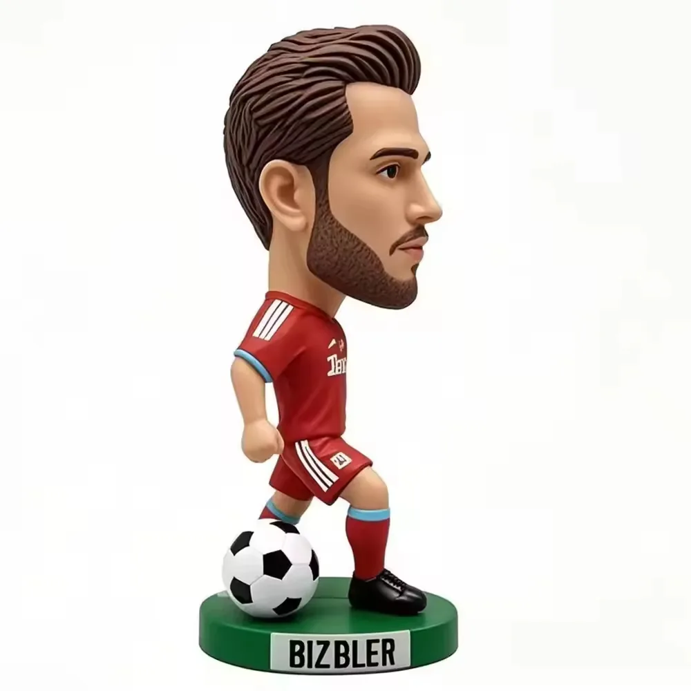 Closer display view of a resin football star figurine showing painted desk-gift styling