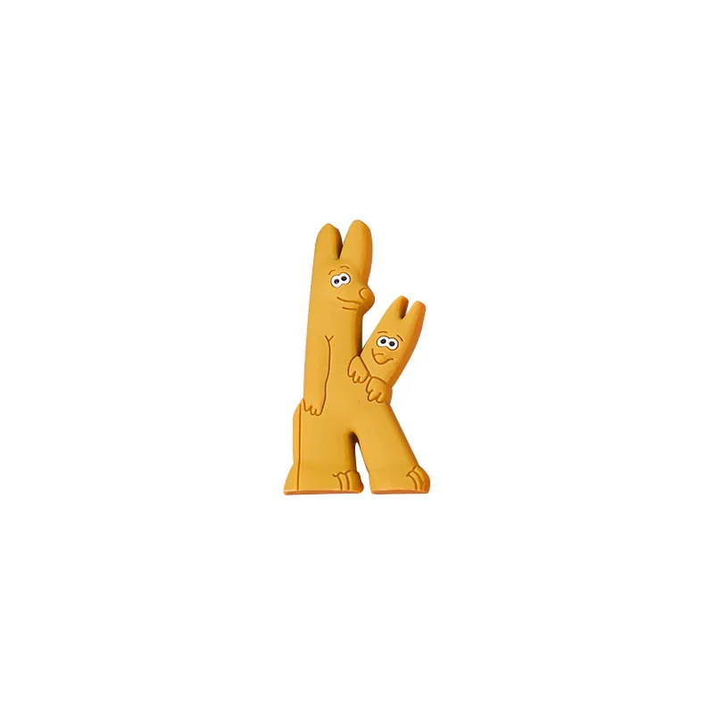 Yellow K character from the animal alphabet PVC letter toy set with a smaller companion letter detail