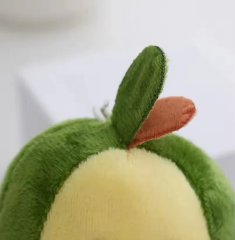 Close-up of the avocado plush keychain top leaf detail with green and brown fabric accents