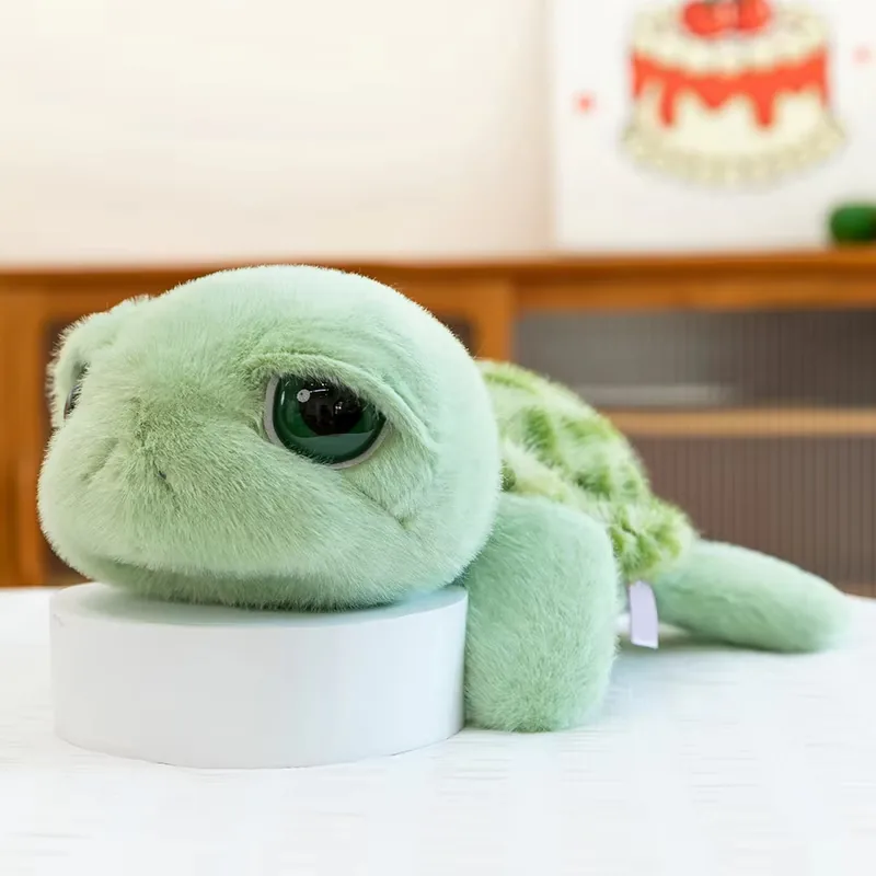 Side view of the big eyes turtle plush doll resting low with a rounded head and soft flippers