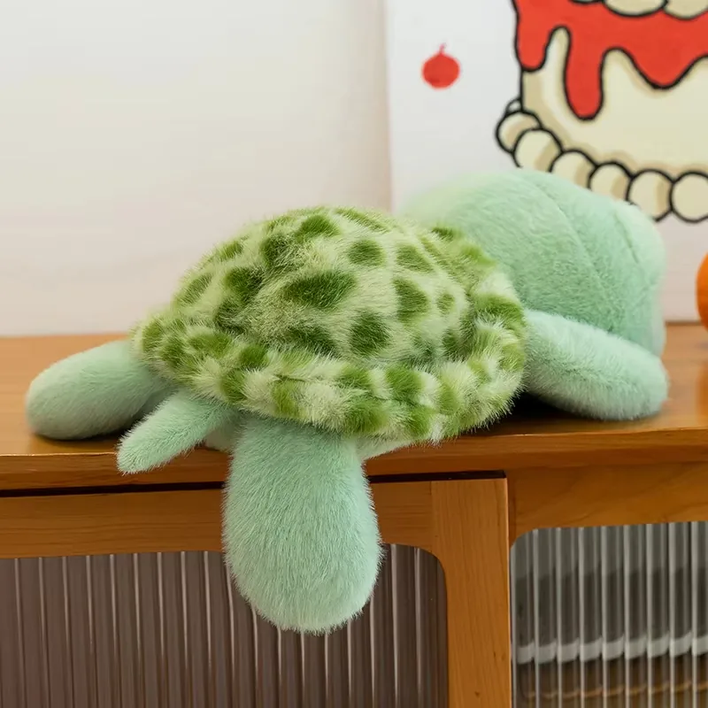 Back view of the turtle plush doll showing a soft shell shape and rear flippers
