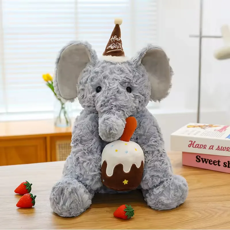 Grey birthday elephant plush doll with oversized ears and white-iced cake accessory