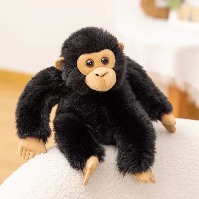 Single black chimpanzee plush doll seated upright with realistic fur and tan face details