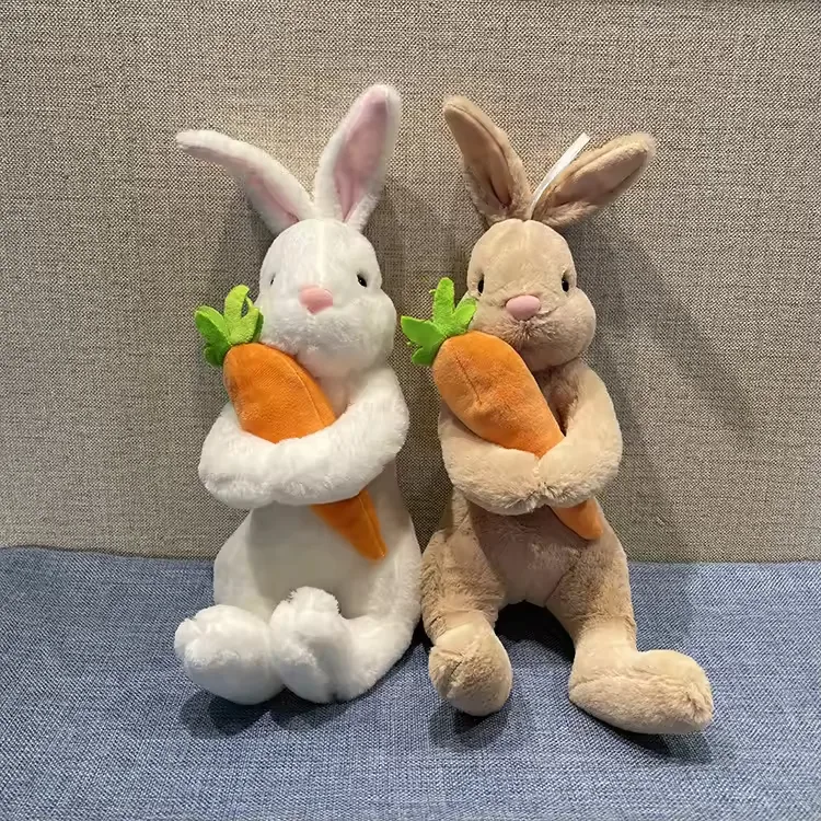 White and beige carrot-hugging rabbit plush dolls shown together in a balanced front-facing pose