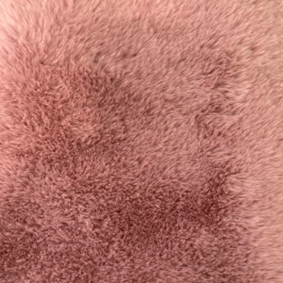 Rose-colored faux fur fabric close-up showing deeper pile and a richer plush texture