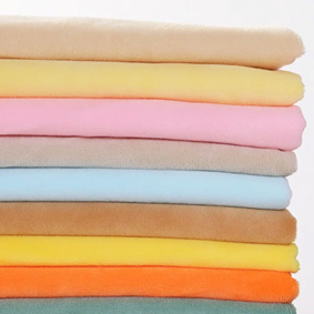 Stacked minky fabric swatches in multiple pastel and bright colors for colorway comparison