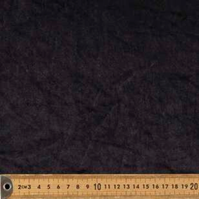 Dark velour plush fabric swatch measured with a ruler to show weight and thickness specifications