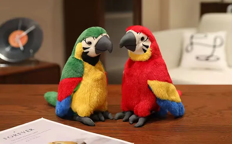 Two plush parrot toys in green and red colorways displayed together on a wooden table