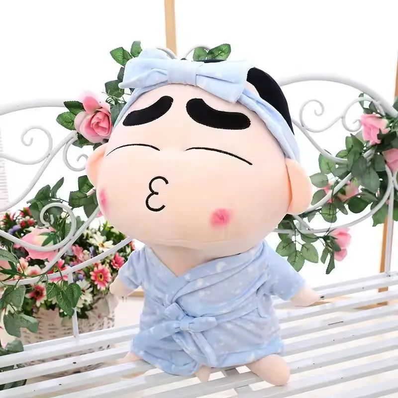 Crayon Shin-chan pajama plush doll with closed eyes, puckered lips, and a blue sleepwear bow headband