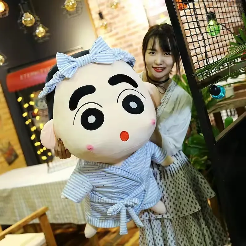 Large Crayon Shin-chan pajama plush doll held in a lifestyle setting to highlight oversized gift and display scale
