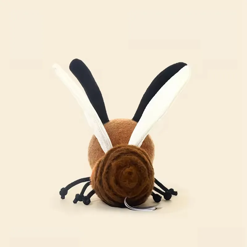 Rear view of plush mosquito toy showing wing placement and rounded segmented body