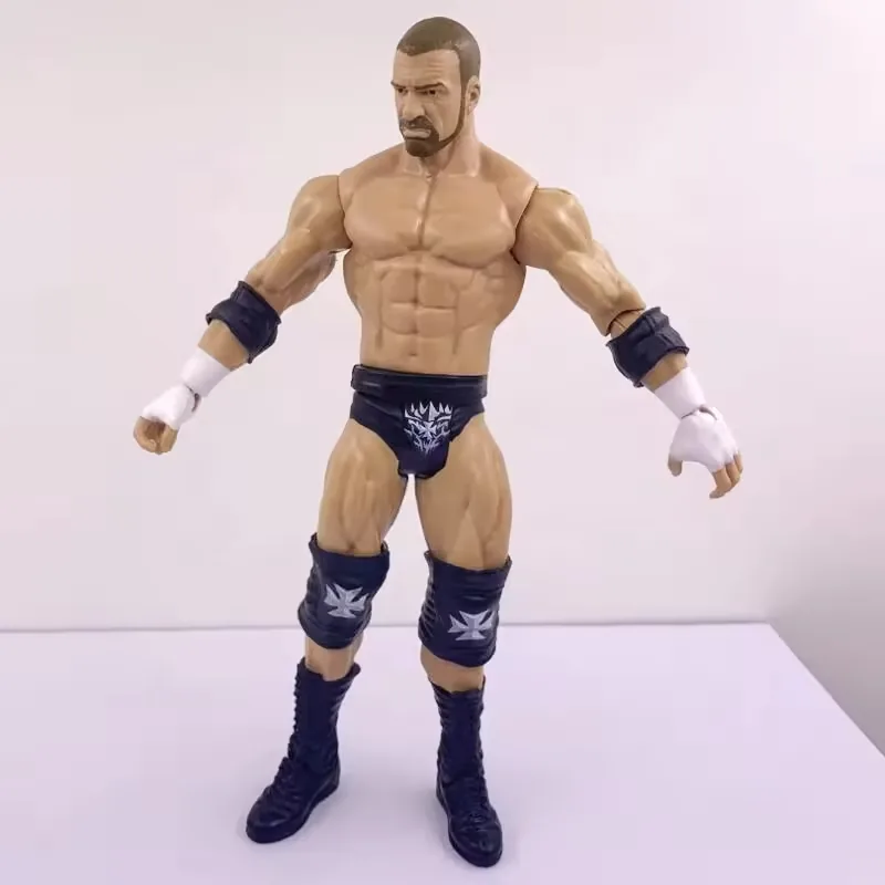 Front standing pose of a custom plastic 7 inch wrestling figure with defined torso sculpt, dark trunks, and knee pads