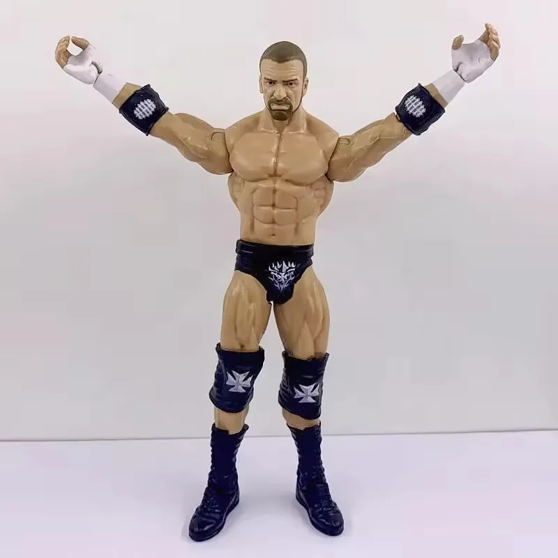 Front view of a movable wrestling-style action figure with both arms raised to show articulation range and torso stability