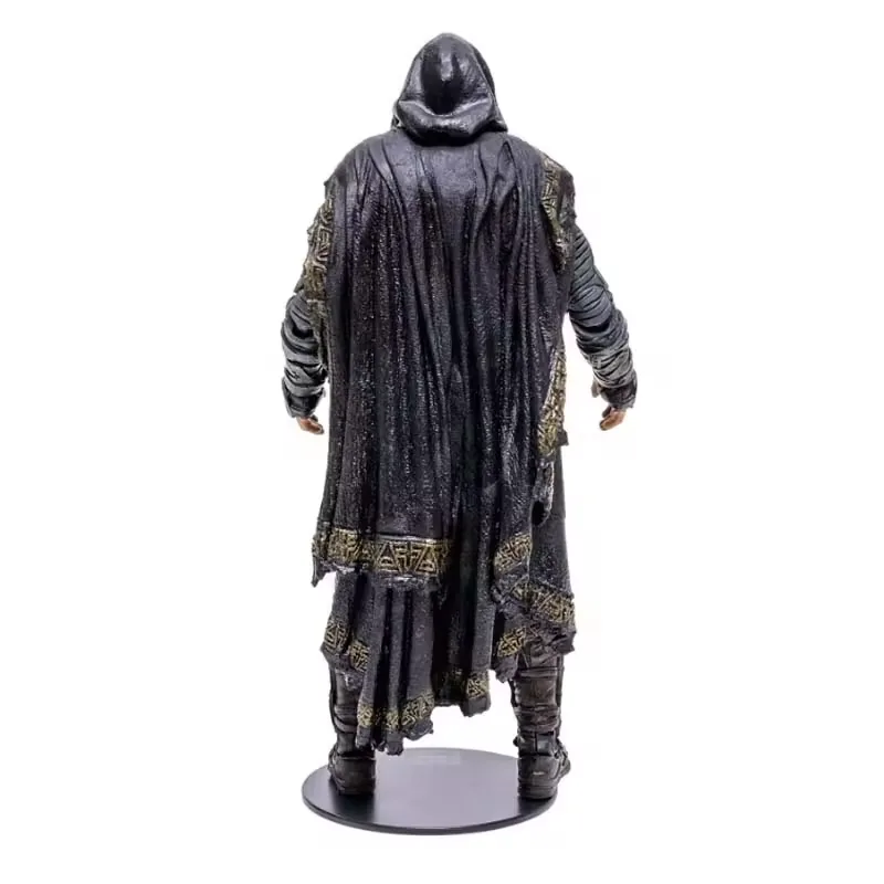 Back view of a hooded PVC action figure with long textured cape and dark armored legs on a round base