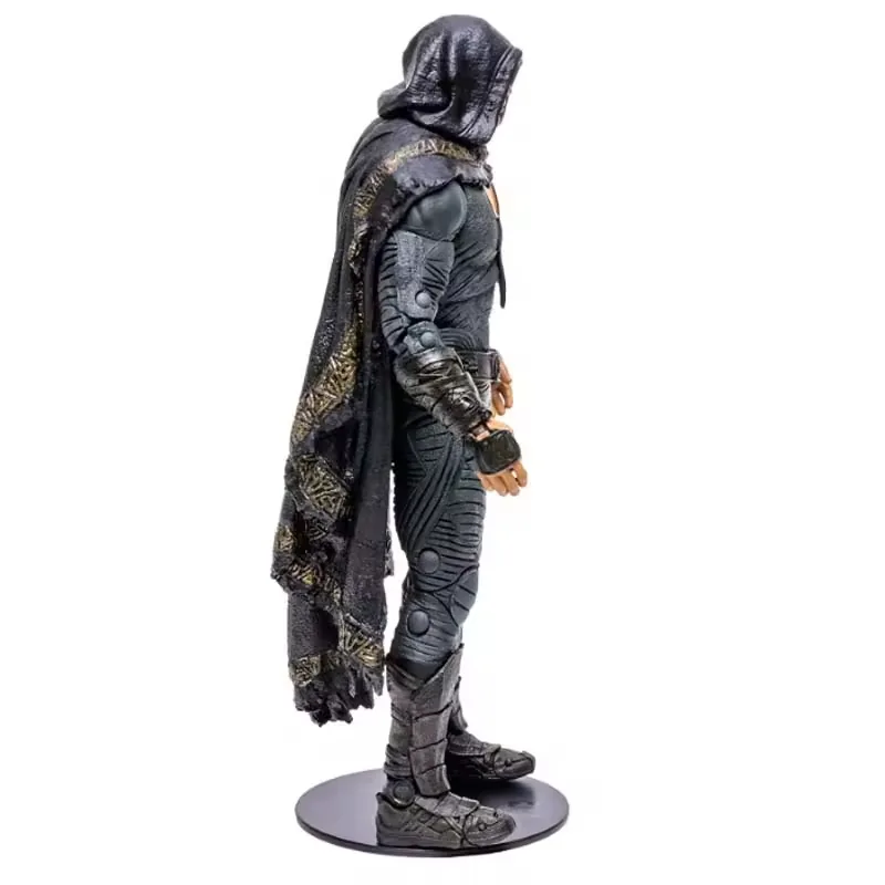 Right-side view of a hooded action figure in dark PVC armor showing cape layering and base depth for box planning