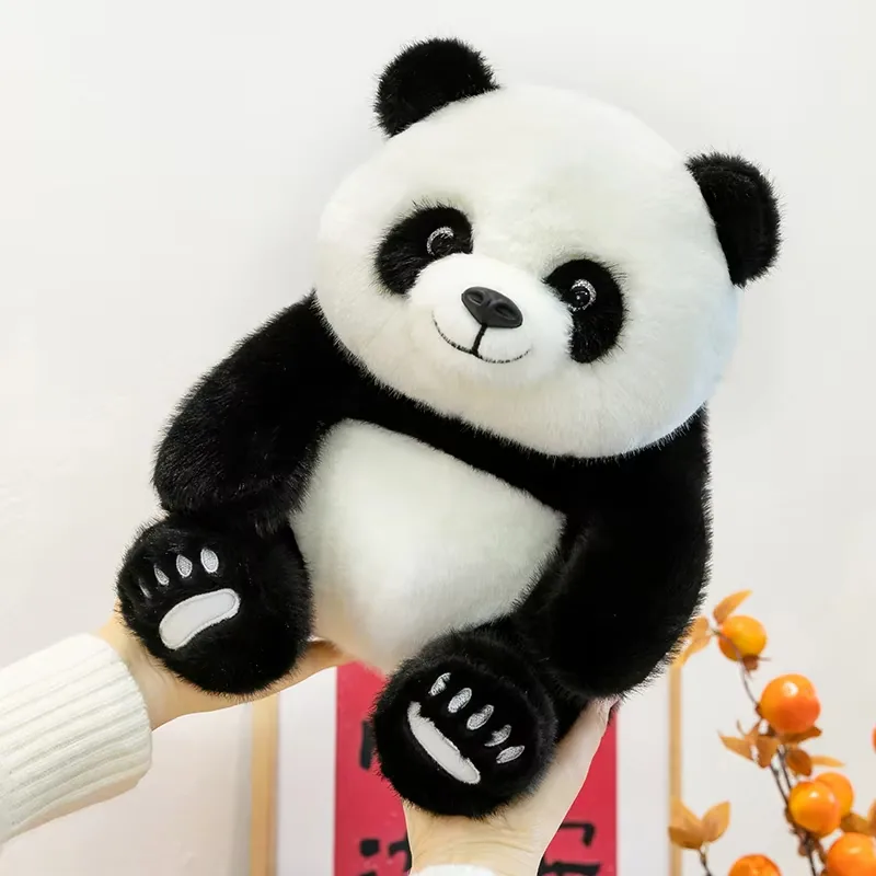 Customizable panda plush toy held in two hands to show gift-ready size and soft seated body