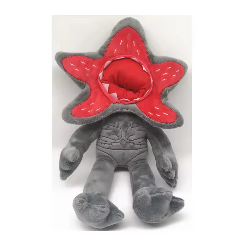Grey Demogorgon plush doll with seated body, stitched torso detail, and red petal-shaped open face