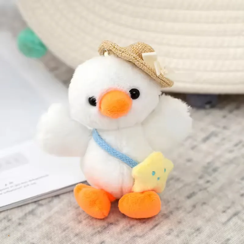 White duck backpack charm plush with straw hat and yellow star bag
