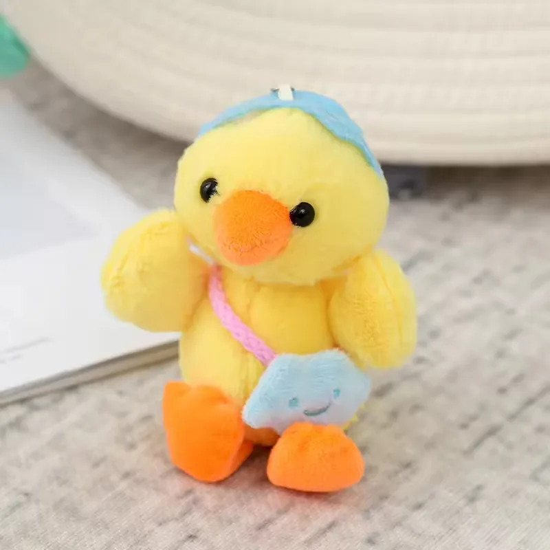 Yellow duck backpack charm plush with blue cap and mini blue star bag