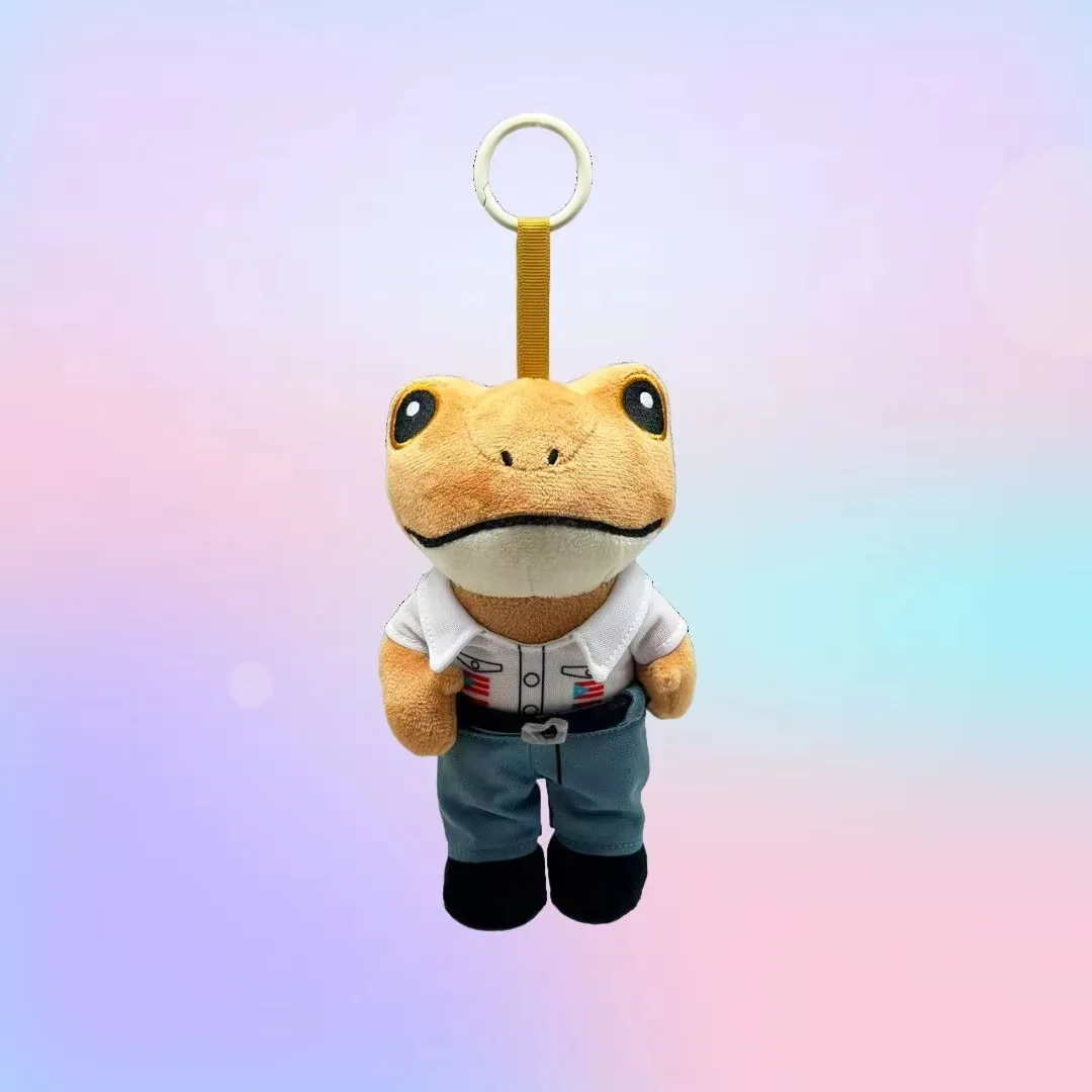 Frog plush keychain wearing a white shirt, blue pants, and black shoes