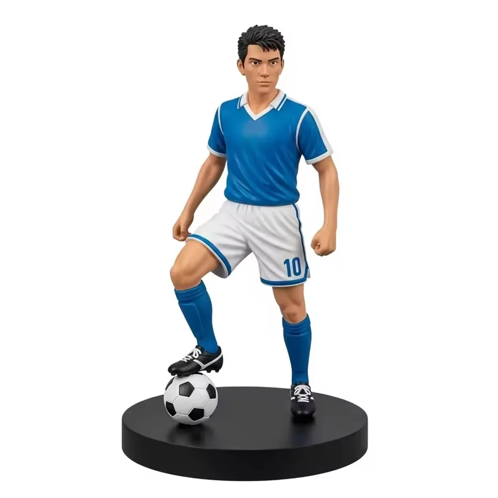 Resin football player sculpture in a blue number 10 kit posed on a black round base with one foot on a football