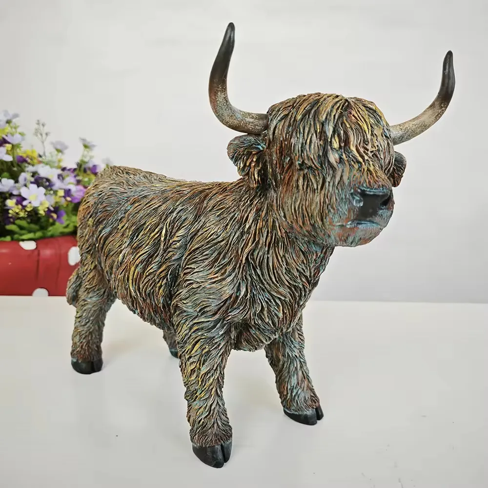 Grey-brown resin Highland cow figurine standing in a three-quarter front pose for countryside decor displays