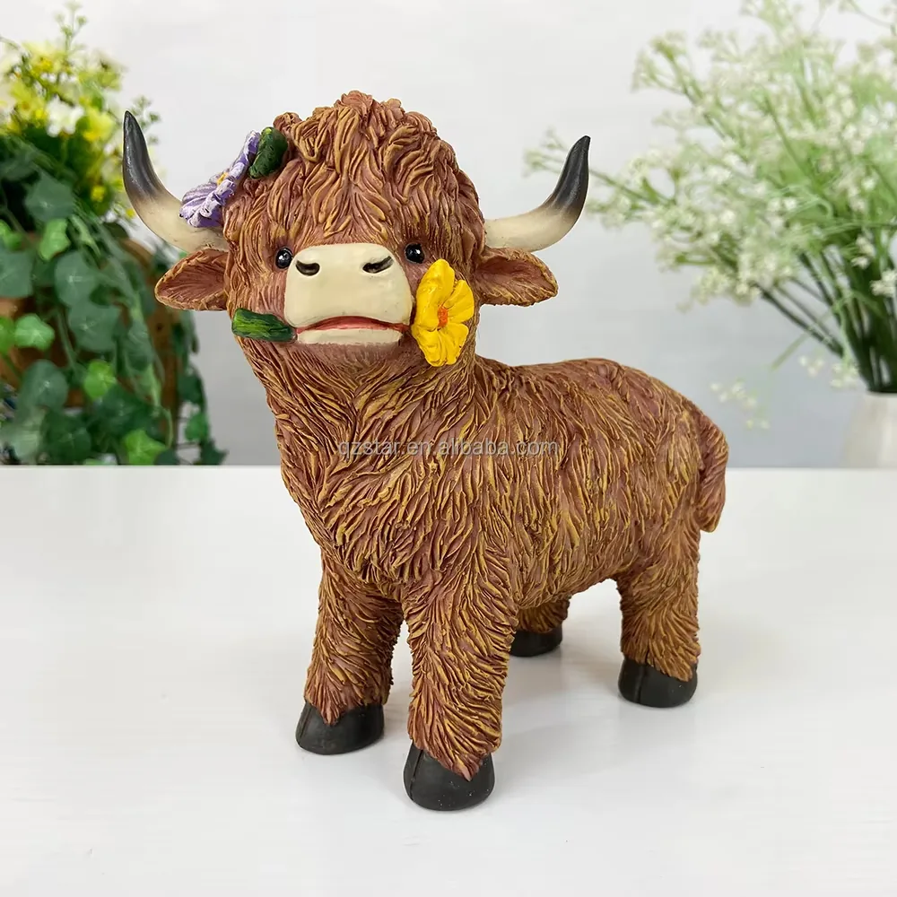 Standing resin Highland cow figurine with floral accent detail near the face for decorative gift programs