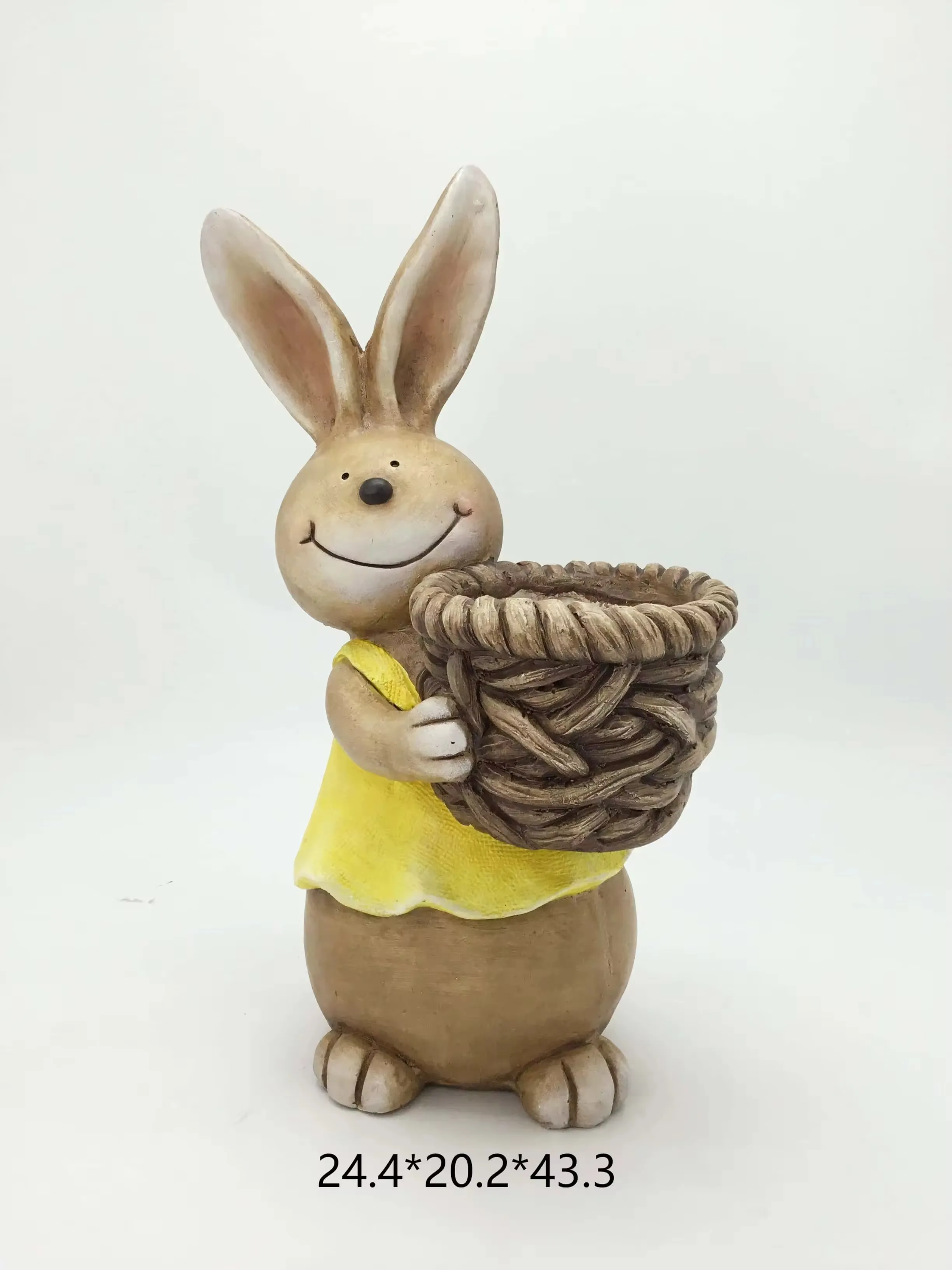 Hand-painted resin rabbit in a yellow dress carrying a woven basket for Easter home decor and spring gift displays