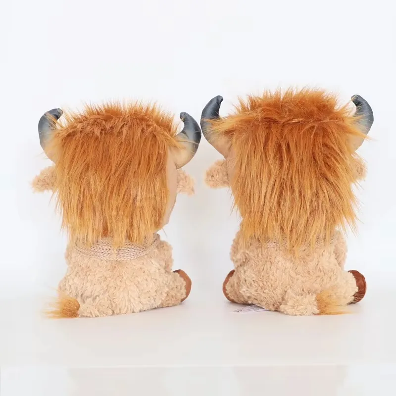 Two highland cow plush dolls shown from the back with long shaggy hair panels, cream curly bodies, and short tails