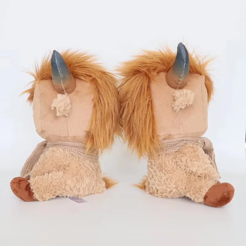 Two highland cow plush dolls shown in side profile to compare plush depth, hair volume, and scarf wrap
