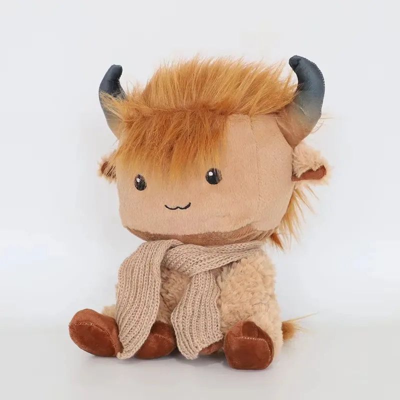 Highland cow plush doll in a three-quarter right angle showing horn curve, scarf drape, and seated feet