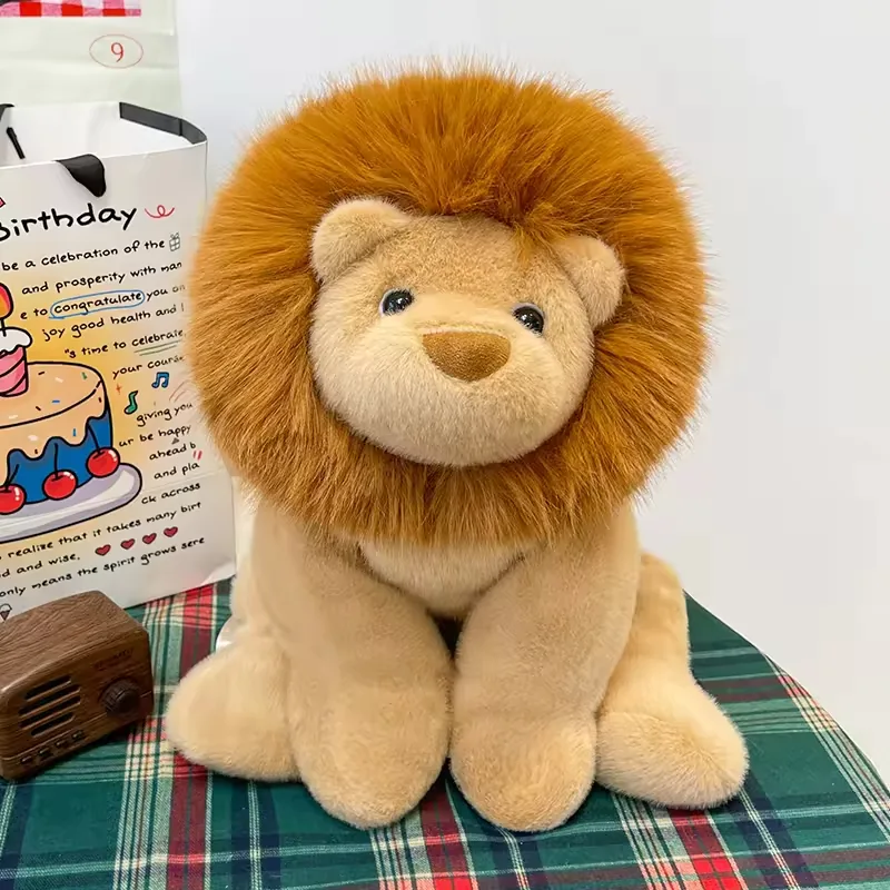 Lion plush backpack bag shown front-facing with a fluffy brown mane and soft beige body