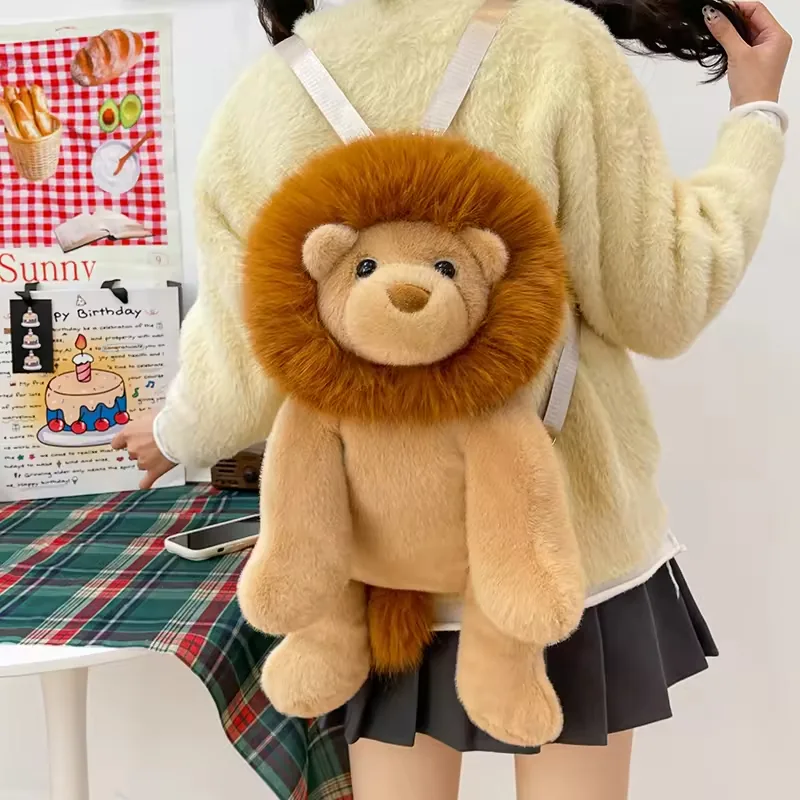Lion plush backpack bag worn on the back with visible shoulder straps and full front lion face