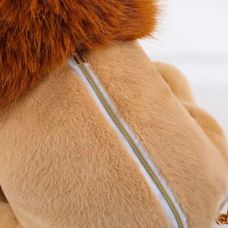 Close-up of lion plush backpack bag zipper running along the rear body opening