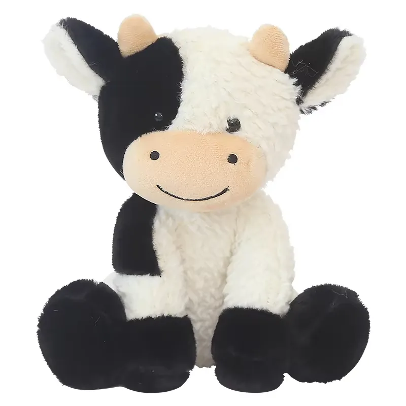 Single milk cow plush doll sitting upright with black-and-white patch pattern, floppy ears, and a smiling peach muzzle