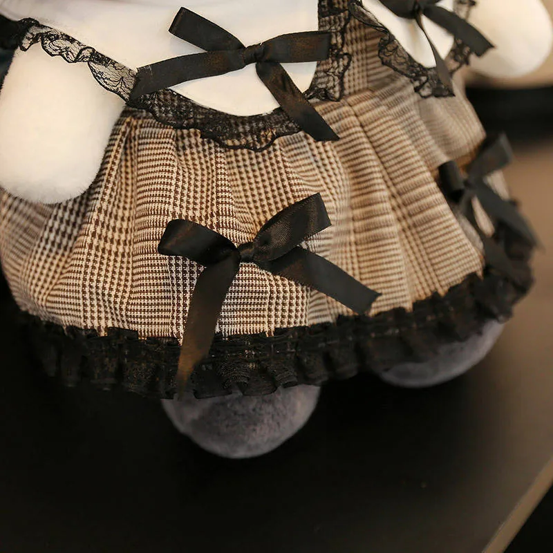 Close-up of the plaid lace skirt and black ribbon details on the gothic princess plush dolls