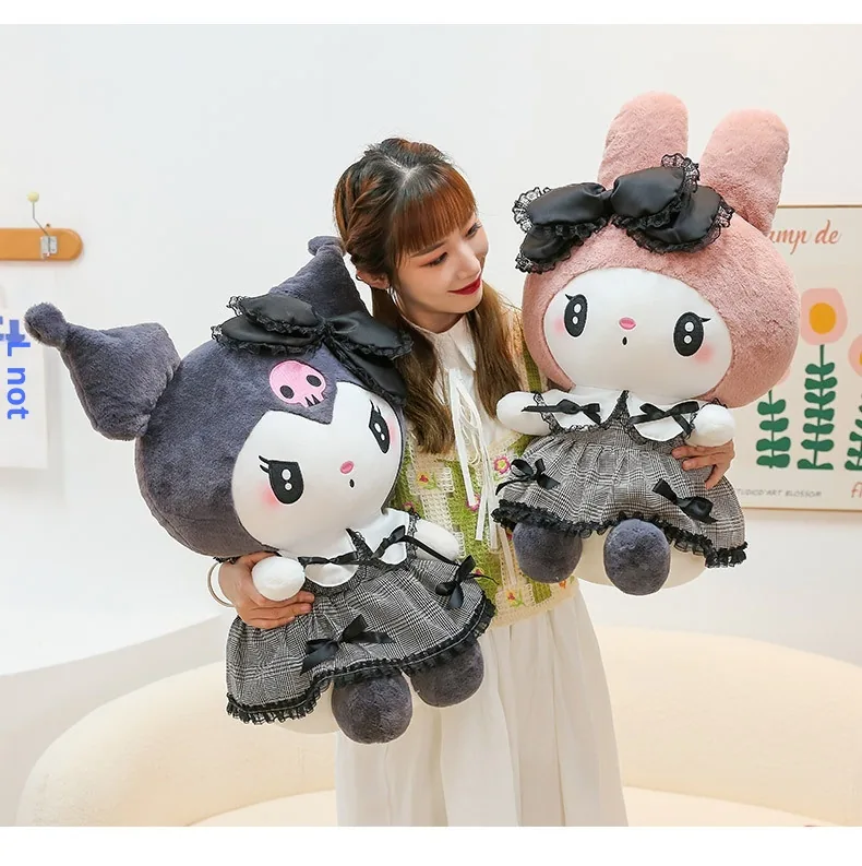 Model holding My Melody and Kuromi gothic plush dolls in large gift-ready sizes