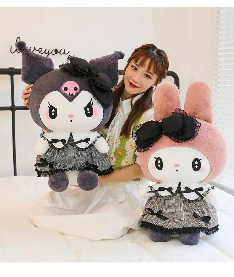 Model seated with My Melody and Kuromi gothic plush dolls in large gift-ready sizes