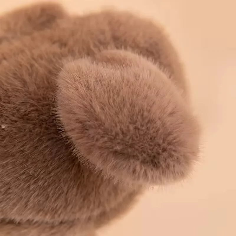 Soft rounded wing detail on the brown ostrich plush doll body