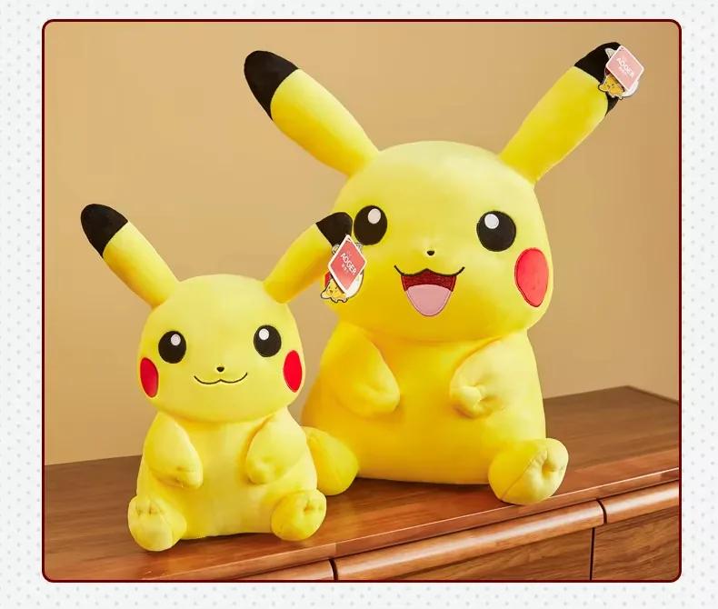 Two seated Pikachu plush dolls shown together in smaller and larger sizes on a wood cabinet