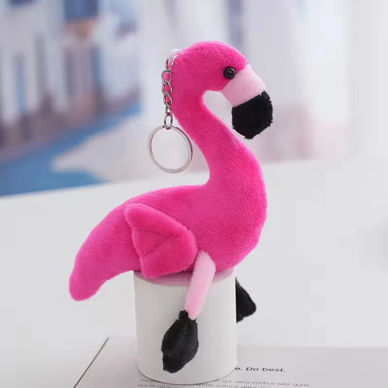 Hot pink flamingo keychain plush charm with black beak and dangling black feet