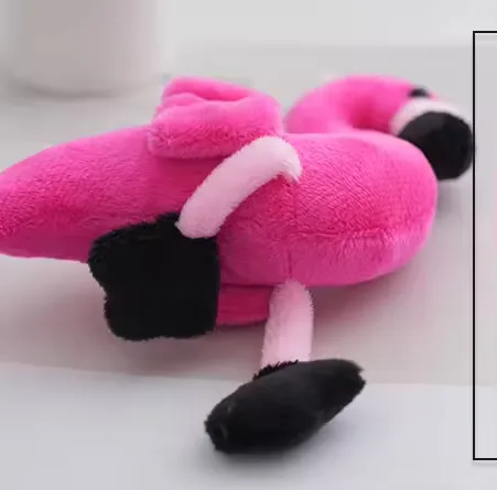 Side profile of the hot pink flamingo keychain plush showing curved neck and narrow body