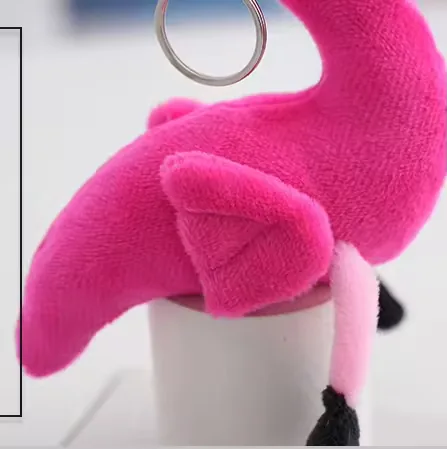 Close-up of the small wing detail on the hot pink flamingo keychain plush charm