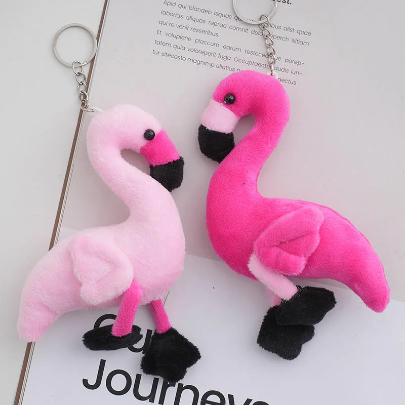 Two flamingo keychain plush charms shown together in pale pink and bright pink colorways