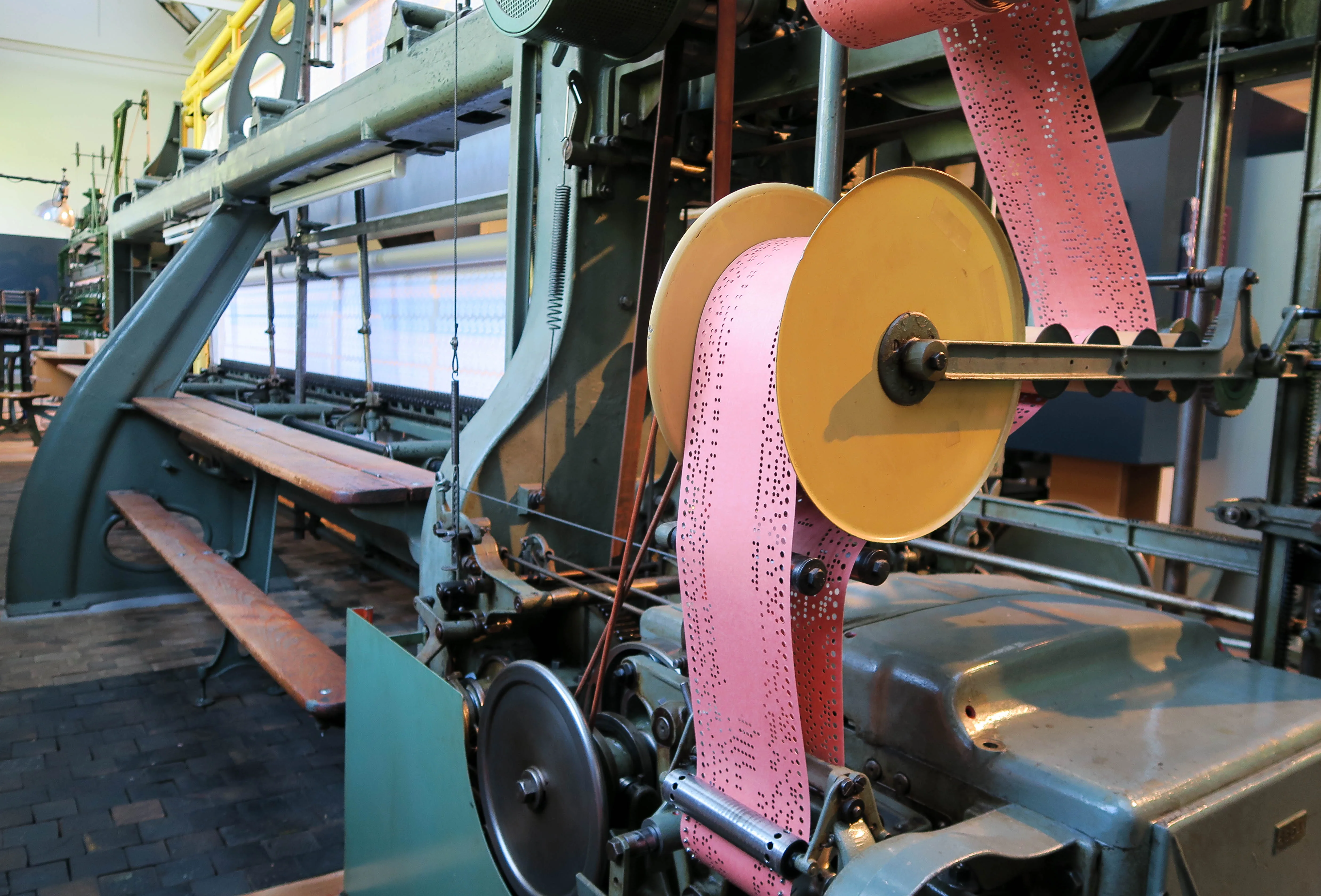 Industrial embroidery control machine using punch-card style pattern guidance