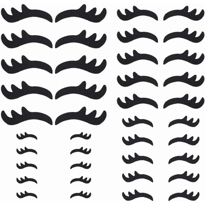 Set of black embroidered eyelash applique pieces used for plush toy facial decoration