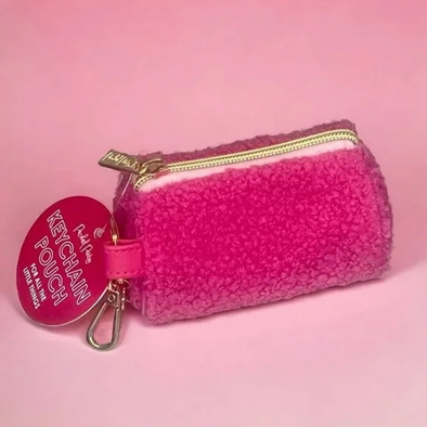 Small plush pouch with a metal zipper pull used as a decorative accessory example