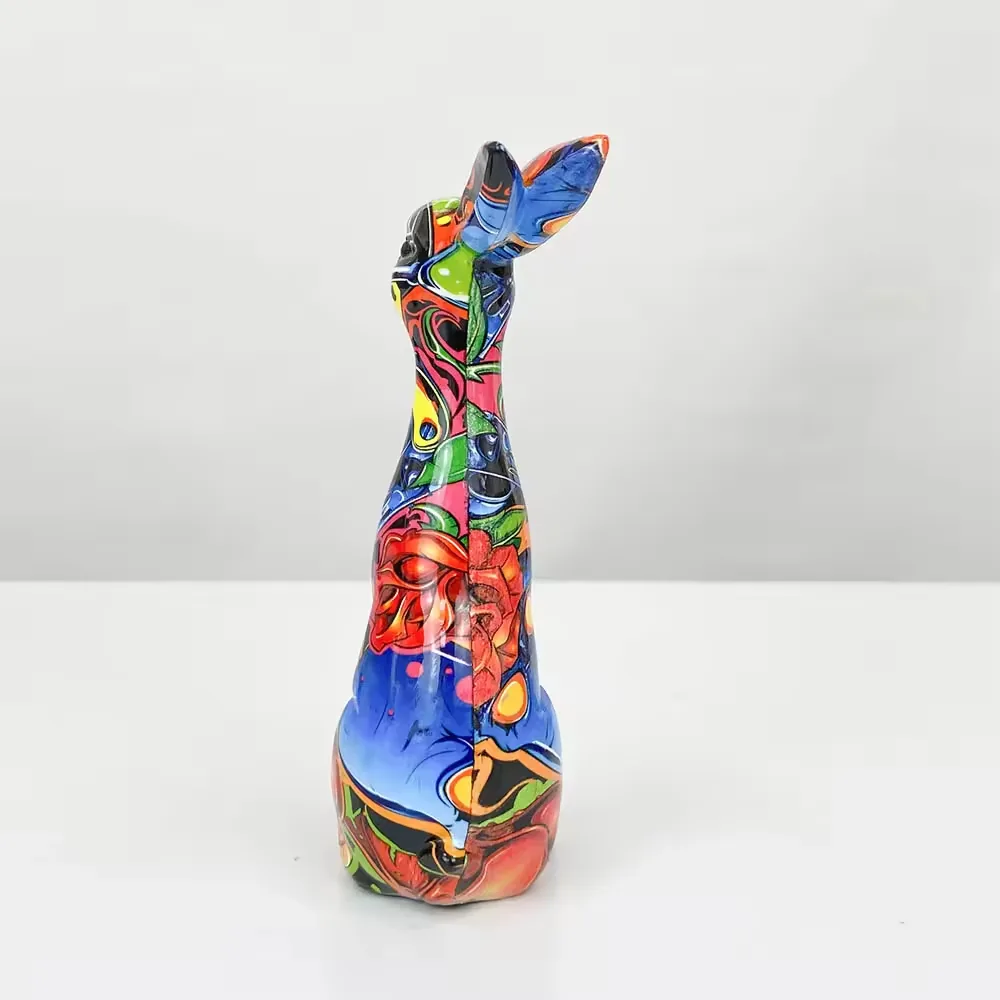 Rear view of a glossy pop-art resin rabbit ornament showing full-wrap graphic coverage across the back
