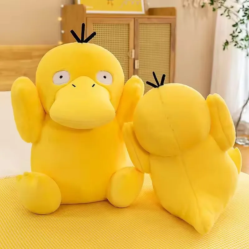 Front and back view of a Psyduck plush doll showing body shape, arm placement, and seam structure