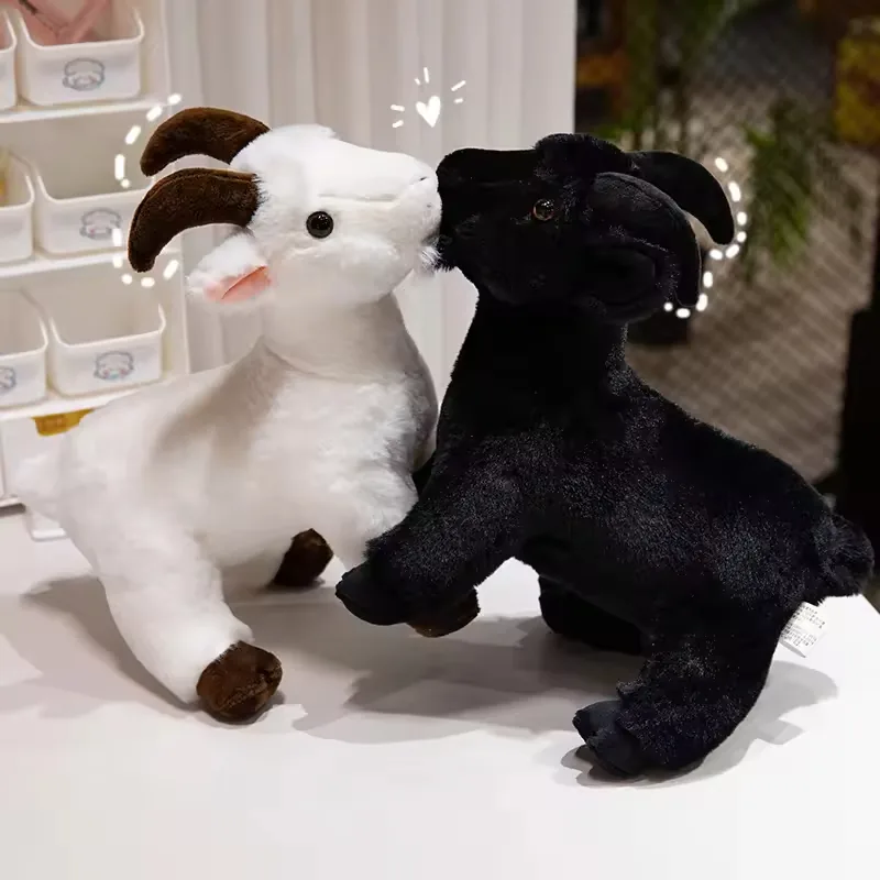 White and black realistic goat plush toys facing each other in a close tabletop display pose